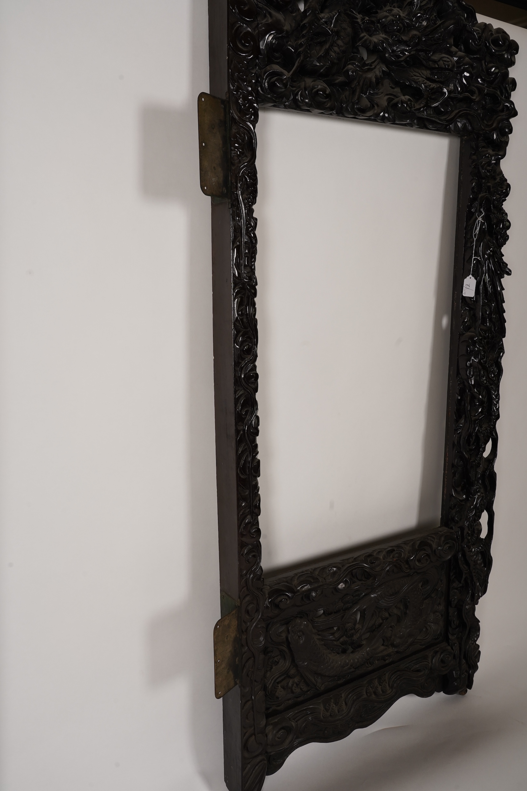 A pair of large Japanese carved hardwood ’dragon’ screen frames, Meiji period